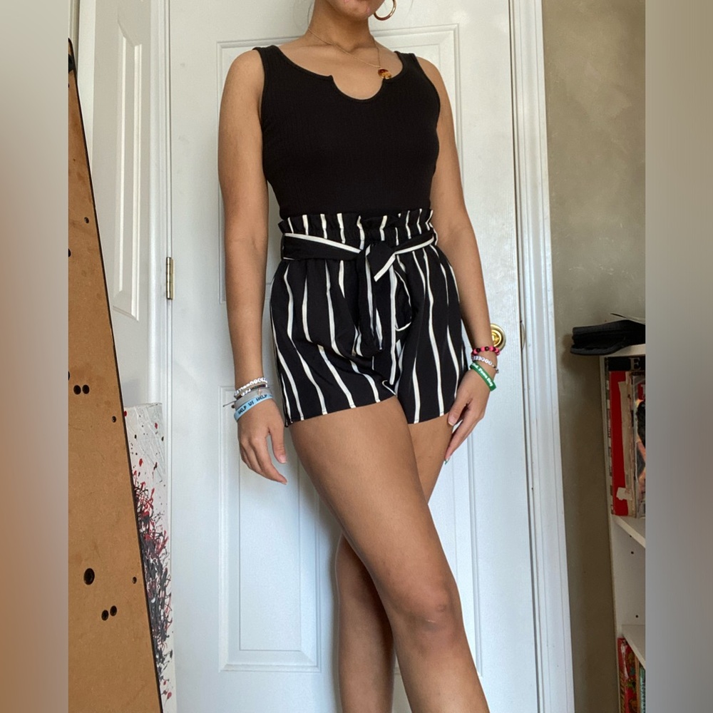 Black and White striped romper with removable tie. Never been worn